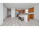 Open concept kitchen with stainless steel appliances, ample cabinet space, and tile flooring at 17216 Goldcrest Loop, Clermont, FL 34714