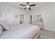 Spacious main bedroom with light wood furniture, ceiling fan and neutral paint at 17216 Goldcrest Loop, Clermont, FL 34714