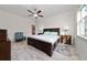 Spacious main bedroom featuring a ceiling fan, tile flooring, and large bed at 17216 Goldcrest Loop, Clermont, FL 34714