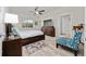 Main bedroom with a large window, ceiling fan, and view to the ensuite bathroom at 17216 Goldcrest Loop, Clermont, FL 34714