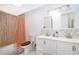 Bathroom featuring a double sink vanity and tiled shower at 1735 Foxhall Cir # 1735, Kissimmee, FL 34741