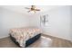 Clean and minimal bedroom featuring wood floors and a window at 1735 Foxhall Cir # 1735, Kissimmee, FL 34741