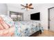 Bright bedroom with ceiling fan, and a sliding glass door to outside at 1735 Foxhall Cir # 1735, Kissimmee, FL 34741