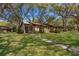 Charming brick townhouse with a well-maintained lawn and mature shade trees at 1735 Foxhall Cir # 1735, Kissimmee, FL 34741