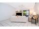 Cozy living room with white tile floors, a fireplace, and a ceiling fan at 1735 Foxhall Cir # 1735, Kissimmee, FL 34741