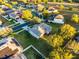 Aerial view of the home with a spacious backyard and surrounding neighborhood streets at 1865 Sanderling Dr, Clermont, FL 34711
