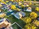 Aerial view of property lines showing the home with a spacious backyard and surrounding neighborhood at 1865 Sanderling Dr, Clermont, FL 34711