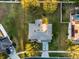 Aerial view of property lines showing the roof, driveway, landscaping, and surrounding neighborhood at 1865 Sanderling Dr, Clermont, FL 34711