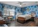 The room is adorned with an artistic Spider-Personal theme and has a window with blinds at 1865 Sanderling Dr, Clermont, FL 34711