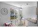 Cozy breakfast nook with a view of the backyard and modern decor at 1865 Sanderling Dr, Clermont, FL 34711