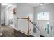 Elegant entryway featuring a wooden staircase and a bright, welcoming foyer at 1865 Sanderling Dr, Clermont, FL 34711