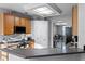 Bright kitchen features oak cabinets, stainless steel appliances, and a skylight at 1865 Sanderling Dr, Clermont, FL 34711