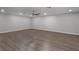 Spacious living room featuring hard surface floors, recessed lighting, and ceiling fan at 1865 Sanderling Dr, Clermont, FL 34711