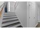 Entry staircase with dark wood and white risers at 1865 Sanderling Dr, Clermont, FL 34711