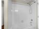 Clean bathroom featuring a white tiled shower over tub and chrome fixtures at 2015 Shalimar Loop, Sanford, FL 32773