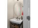 Small bathroom with sink and vanity in neutral colors at 2015 Shalimar Loop, Sanford, FL 32773
