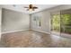 Bedroom with tile floors and access to a screened lanai at 2015 Shalimar Loop, Sanford, FL 32773