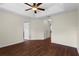 Bright bedroom features hardwood floors, ceiling fan, and neutral wall color at 2015 Shalimar Loop, Sanford, FL 32773