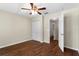 Bedroom with hardwood floors, ceiling fan, and a double door closet at 2015 Shalimar Loop, Sanford, FL 32773