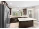 Bright and open kitchen featuring stainless steel appliances and large island with quartz countertops at 2015 Shalimar Loop, Sanford, FL 32773