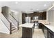 Open concept kitchen with stainless steel appliances and a large island at 2015 Shalimar Loop, Sanford, FL 32773
