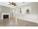 Open living room featuring a fireplace and an archway leading to other rooms at 2015 Shalimar Loop, Sanford, FL 32773