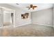 Open living area with tile flooring and views to kitchen, hallway, and staircase at 2015 Shalimar Loop, Sanford, FL 32773
