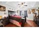 Main bedroom features a tray ceiling, a ceiling fan, and hardwood floors at 2015 Shalimar Loop, Sanford, FL 32773