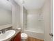 Bathroom featuring a vanity and a shower-tub combination with a white surround at 209 Fig Ct, Kissimmee, FL 34759