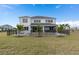 Backyard featuring a sparkling pool, lounge chairs, and patio seating, ideal for entertaining at 2141 Weatherly Way, Orlando, FL 32820