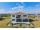 Aerial view of home with pool, fenced yard, patio, and lush lawn perfect for outdoor enjoyment at 2141 Weatherly Way, Orlando, FL 32820