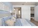 Bedroom showing access to ensuite bathroom and staircase with iron railing at 2141 Weatherly Way, Orlando, FL 32820
