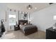 Bedroom featuring modern decor, a stylish ceiling fan and abundant natural light at 2141 Weatherly Way, Orlando, FL 32820