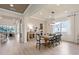Bright dining room features a wooden table, modern light fixture, and neutral decor at 2141 Weatherly Way, Orlando, FL 32820