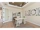Bright home office featuring stylish decor, modern lighting, and ample workspace for productivity at 2141 Weatherly Way, Orlando, FL 32820