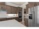 Gourmet kitchen with stainless steel appliances, quartz countertops, and modern design at 2141 Weatherly Way, Orlando, FL 32820