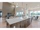 Open-concept kitchen with a large island and stainless steel appliances at 2141 Weatherly Way, Orlando, FL 32820