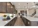 Modern kitchen with stainless steel appliances, spacious island and sleek countertops at 2141 Weatherly Way, Orlando, FL 32820