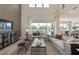 Open-concept living room with large windows and comfortable seating at 2141 Weatherly Way, Orlando, FL 32820