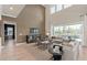 Spacious living room featuring high ceilings and a view of the pool at 2141 Weatherly Way, Orlando, FL 32820
