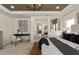 Beautiful main bedroom with elegant decor, a seating area, and views through large windows at 2141 Weatherly Way, Orlando, FL 32820