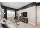Cozy media room with comfortable seating and a large screen TV at 2141 Weatherly Way, Orlando, FL 32820
