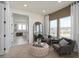 Sitting area with comfortable chairs, a stylish mirror, and a glimpse into the luxurious bathroom at 2141 Weatherly Way, Orlando, FL 32820