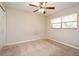 Comfortable bedroom with natural light and ceiling fan features neutral walls and carpeted floor at 2519 Poinsetta Ave, Sanford, FL 32773