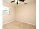 Bright bedroom featuring a ceiling fan, neutral walls, a window, and cozy carpet flooring at 2519 Poinsetta Ave, Sanford, FL 32773