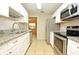 Well-lit kitchen featuring stainless steel appliances, granite countertops, and stylish cabinetry at 2519 Poinsetta Ave, Sanford, FL 32773