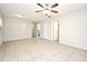 Large living space with tile floors, ceiling fan, and ample natural light at 2519 Poinsetta Ave, Sanford, FL 32773
