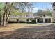A house with blooming bushes under the windows and an enclosed patio, set in a scenic setting at 2525 W Ponkan Rd, Apopka, FL 32712