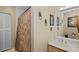Bathroom with a curtained shower, vanity, and decorative wall art, creating a functional and stylish space at 2525 W Ponkan Rd, Apopka, FL 32712