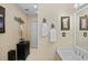 Bathroom sink with floral decor, a white cabinet, and a framed picture, enhancing the space's aesthetic at 2525 W Ponkan Rd, Apopka, FL 32712